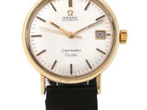 Title: Seamaster De Ville 14k gold dress watch from 1960s
Brand: Omega
Model: Seamaster De Ville
Ref: null
Category: Dress
Diameter: 34mm
Functions: Dato
Year: 1960
Price: 9000
Condition: undefined
Dial Color: Sølv
Strap: Læder
Case material: Guld
Gender: Herre
Match: 100.0%
Billedet er ejet af Bruun Rasmussen (417459) Et Omega ur
