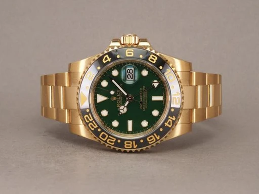 Title: GMT - Money Dial - 116718LN - NOS On hold
Brand: Rolex
Model: GMT-Master II 18K
Ref: 116718LN
Category: Pilot
Diameter: 40mm
Functions: Dato, GMT
Year: 2016
Price: 280000
Condition: undefined
Dial Color: Grøn
Strap: Metal
Case material: Guld
Gender: Herre
Match: 100.0%
Billedet er ejet af Chrono (386169) Et Rolex ur