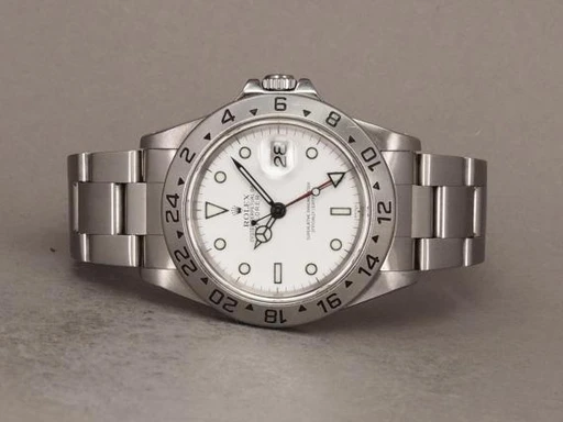 Title: Explorer II 16570 Swiss Only
Brand: Rolex
Model: Explorer II
Ref: 16570
Category: Sport
Diameter: 40mm
Functions: Dato, GMT
Year: 1999
Price: 49000
Condition: undefined
Dial Color: Hvid
Strap: Metal
Case material: Stål
Gender: Herre
Match: 100.0%
Billedet er ejet af Chrono (149677) Et Rolex ur