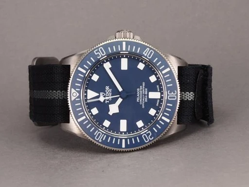 Title: Pelagos FXD MN21 - 11/2021
Brand: Tudor
Model: Pelagos FXD MN 2021
Ref: 25707B/21
Category: Dykker
Diameter: 42mm
Functions: Dato
Year: 2021
Price: 28000
Condition: undefined
Dial Color: Blå
Strap: Stof
Case material: Titanium
Gender: Herre
Match: 100.0%
Billedet er ejet af Chrono (101131) Et Tudor ur