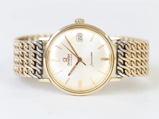 Title: Seamaster
Brand: Omega
Model: Seamaster
Ref: 14770
Category: Dress
Diameter: 34mm
Functions: Dato
Year: null
Price: 5500
Condition: undefined
Dial Color: Hvid
Strap: Metal
Case material: Guld
Gender: Herre
Match: 100.0%
Billedet er ejet af Chrono Collective (102401) Et Omega ur