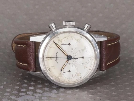 Title: Chronograph Vintage VD 712
Brand: Minerva
Model: Minerva VD 712 Chronograph
Ref: VD712
Category: Racing
Diameter: 36mm
Functions: Kronograf
Year: 1960
Price: 24000
Condition: undefined
Dial Color: Hvid
Strap: Læder
Case material: Stål
Gender: Herre
Match: 100.0%
Billedet er ejet af Chrono (101338) Et Minerva ur