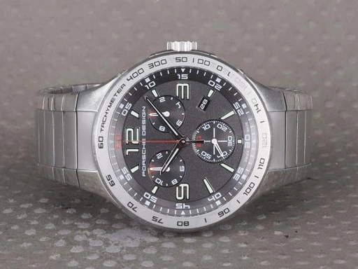 Title: P6000 Chronograph
Brand: Porsche Design
Model: Flat Six Chronograph
Ref: 6320.41
Category: Racing
Diameter: 44mm
Functions: Kronograf, Dato
Year: null
Price: 8000
Condition: undefined
Dial Color: Sort
Strap: Metal
Case material: Stål
Gender: Herre
Match: 100.0%
Billedet er ejet af Chrono (101350) Et Porsche Design ur