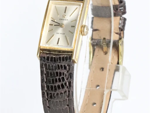 Title: De Ville
Brand: Omega
Model: De Ville
Ref: KU5051
Category: Dress
Diameter: 14mm
Functions: 
Year: 1960
Price: 6000
Condition: undefined
Dial Color: Sølv
Strap: Læder
Case material: Guld
Gender: Dame
Match: 100.0%
Billedet er ejet af Krognos (347366) Et Omega ur