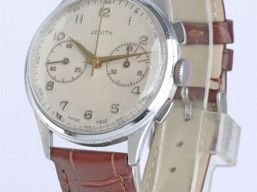 Title: Kronograf
Brand: Zenith
Model: Kronograf
Ref: KU2559
Category: Racing
Diameter: 36mm
Functions: Kronograf
Year: 1950
Price: 14800
Condition: undefined
Dial Color: Hvid
Strap: Læder
Case material: Stål
Gender: Herre
Match: 100.0%
Billedet er ejet af Krognos (102303) Et Zenith ur