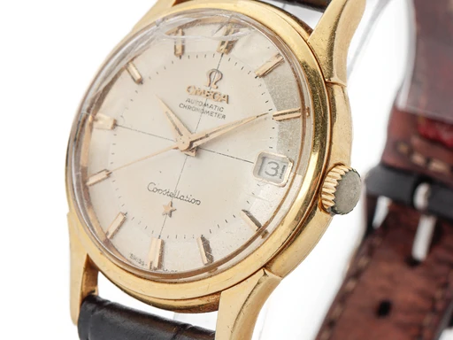 Title: Constellation 'Pie Pan' armbåndsur af guld (New)
Brand: Omega
Model: Constellation 'Pie Pan'
Ref: null
Category: Dress
Diameter: 34mm
Functions: Dato
Year:
Price: 8000
Condition: 4.0
Dial Color: Gul
Strap: Læder
Case material: Guld
Gender: Herre
Match: 100.0%
Billedet er ejet af Lauritz (547245) Et Omega ur