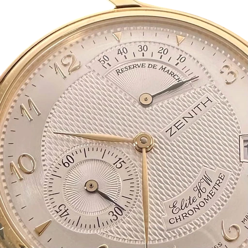 Title: Elite Power Reserve - 36 mm
Brand: Zenith
Model: Elite Power Reserve
Ref: 30.0240.655/01
Category: Dress
Diameter: 36mm
Functions: Dato
Year: 1998
Price: 47500
Condition: 9.0
Dial Color: Sølv
Strap: Læder
Case material: Guld
Gender: Herre
Match: 100.0%
Billedet er ejet af Limited Watches (152275) Et Zenith ur