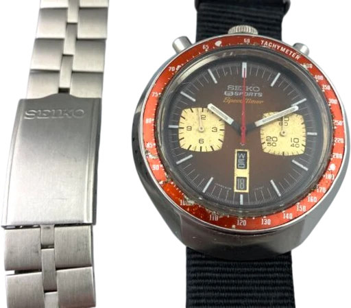 Title: 2182 – Bullhead 6/1975
Brand: Seiko
Model: Seiko Bullhead
Ref: 6138-0040
Category: Racing
Diameter: 42mm
Functions: Kronograf, Dato, Ugedag
Year: 1975
Price: 5995
Condition: 8.0
Dial Color: Sort
Strap: Andet
Case material: Stål
Gender: Herre
Match: 100.0%
Billedet er ejet af MyWatch (102089) Et Seiko ur