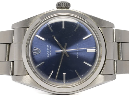 Title: Oyster Precision 34, Blå, Stål, Oyster
Brand: Rolex
Model: Oyster Precision
Ref: 6426
Category: Dress
Diameter: 34mm
Functions: Dato
Year: 1971
Price: 34900
Condition: 7.0
Dial Color: Blå
Strap: Metal
Case material: Stål
Gender: Herre
Match: 100.0%
Billedet er ejet af Urhandleren (357225) Et Rolex ur